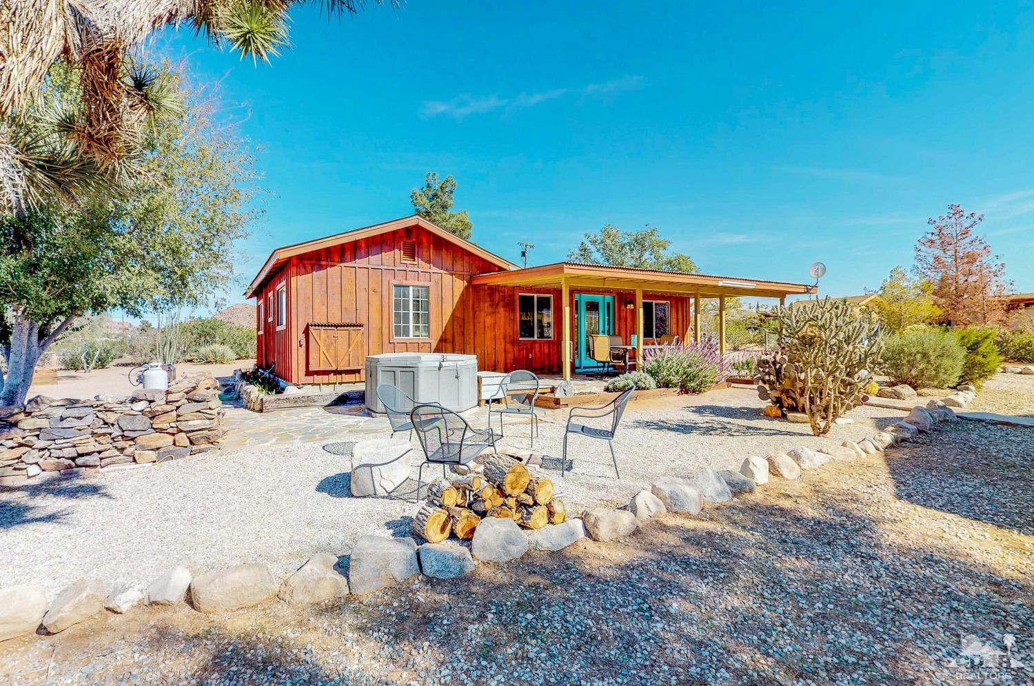 63443 Quail Springs Road Joshua Tree, CA 92252 - Photo 1 of 17 a view of backyard of the house