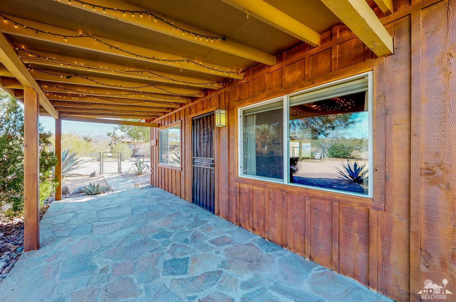 63443 Quail Springs Road Joshua Tree, CA 92252 - Photo 14 of 17 a view of a porch