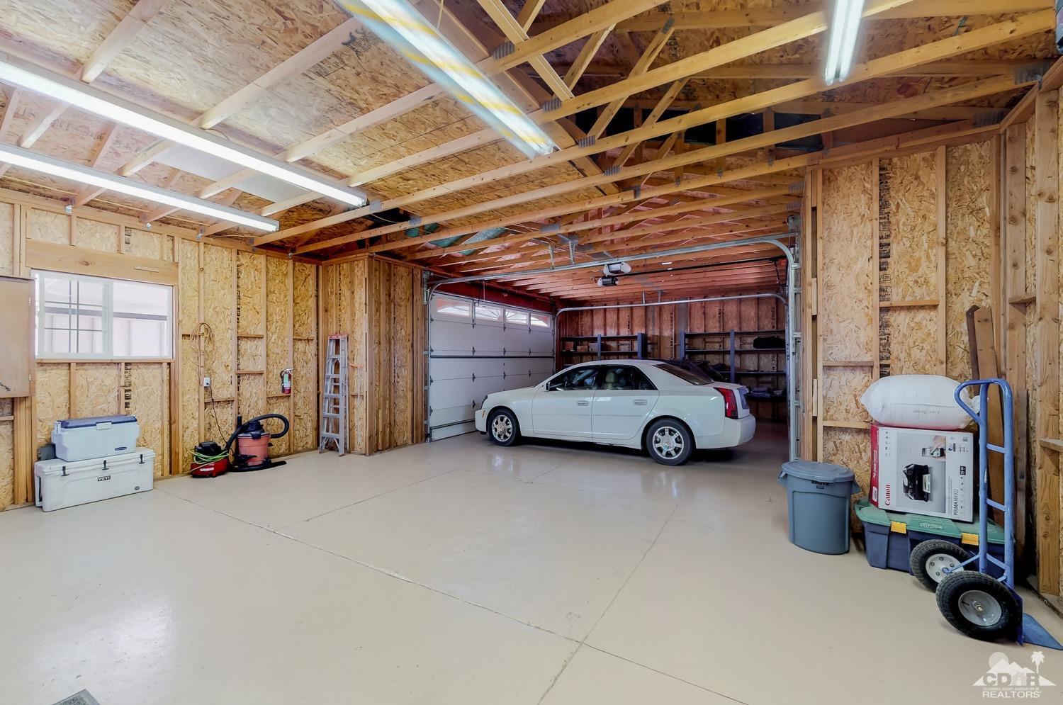 63443 Quail Springs Road Joshua Tree, CA 92252 - Photo 15 of 17 a view of parking garage with cars