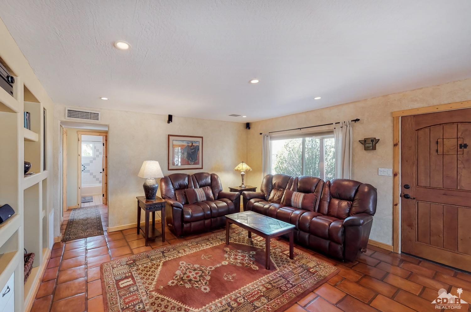 63443 Quail Springs Road Joshua Tree, CA 92252 - Photo 4 of 17 a living room with furniture rug and window