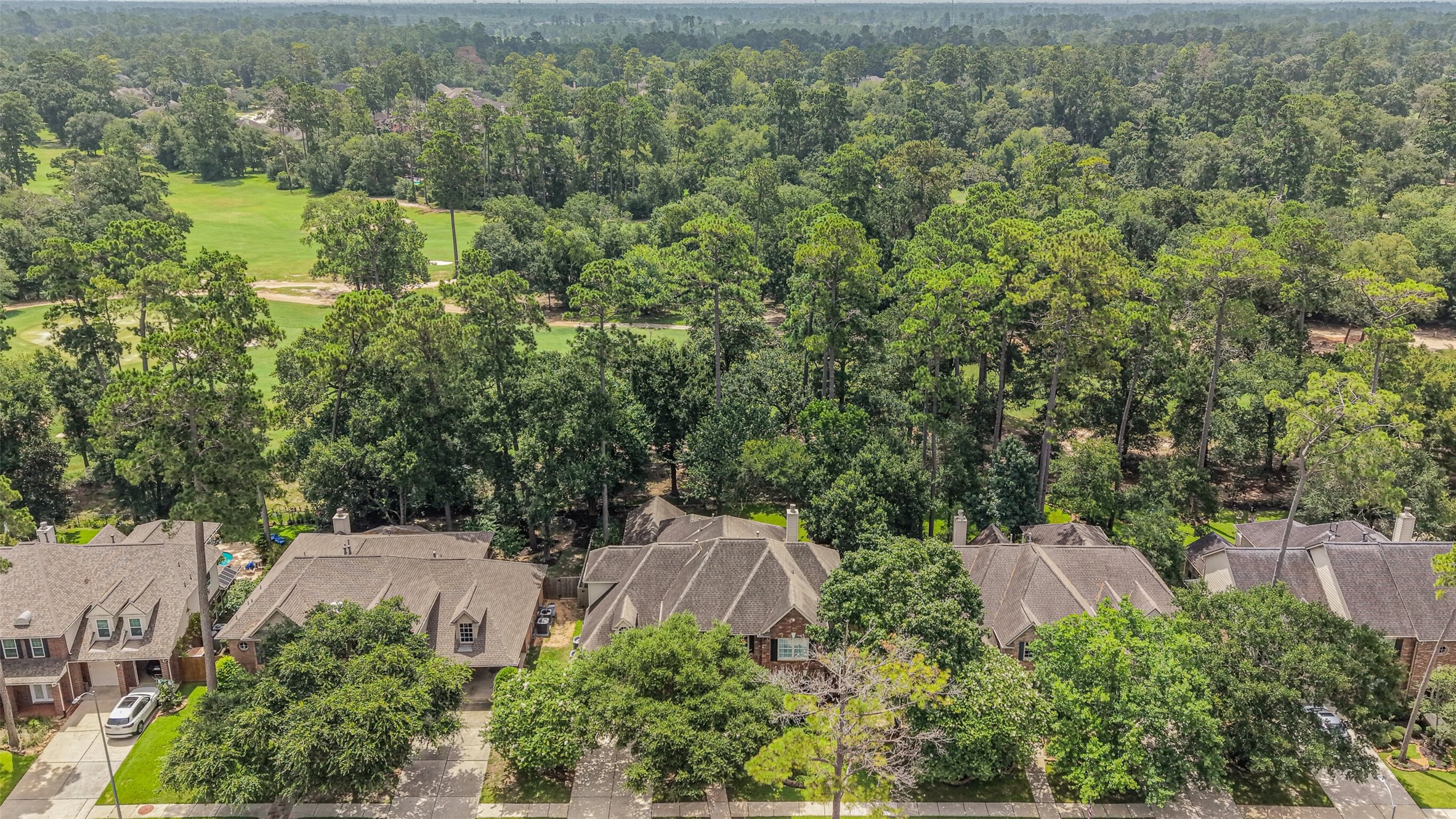 14919 Codys Run Cypress, TX 77429 - Photo 25 of 32 From above, it's easy to appreciate what makes this property so special. Nestled among towering mature trees and backing to the golf course, this home enjoys a peaceful setting with a level of privacy that's rarely found on golf course properties.