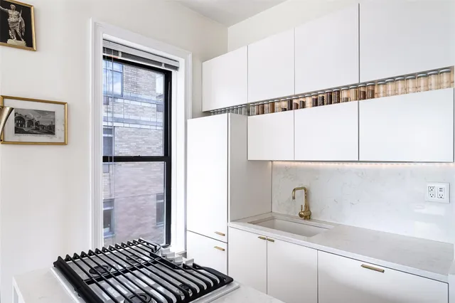 a kitchen with a sink and a stove