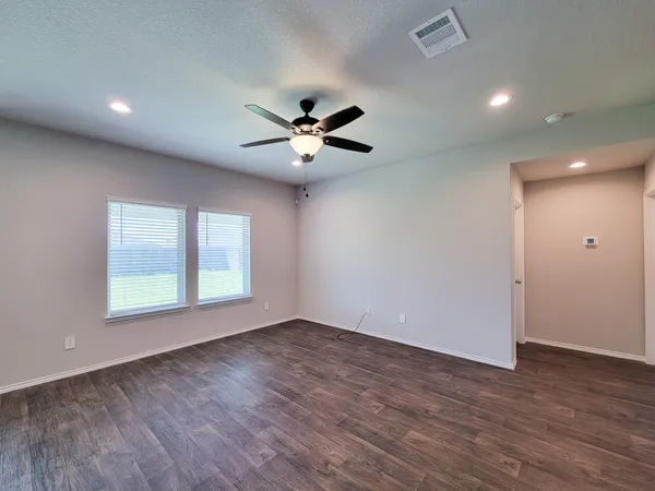 a view of an empty room with a window