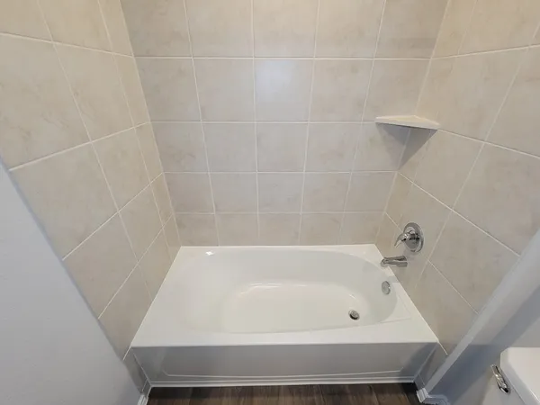 a bathroom with a toilet a sink and bathtub