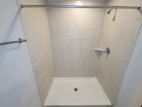 a kitchen with a sink and refrigerator