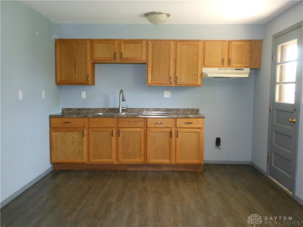 143 West Emerick Road West Milton, OH 45383 - Photo 9 of 37 This functional kitchen features ample cabinetry and durable flooring, ideal for everyday living.