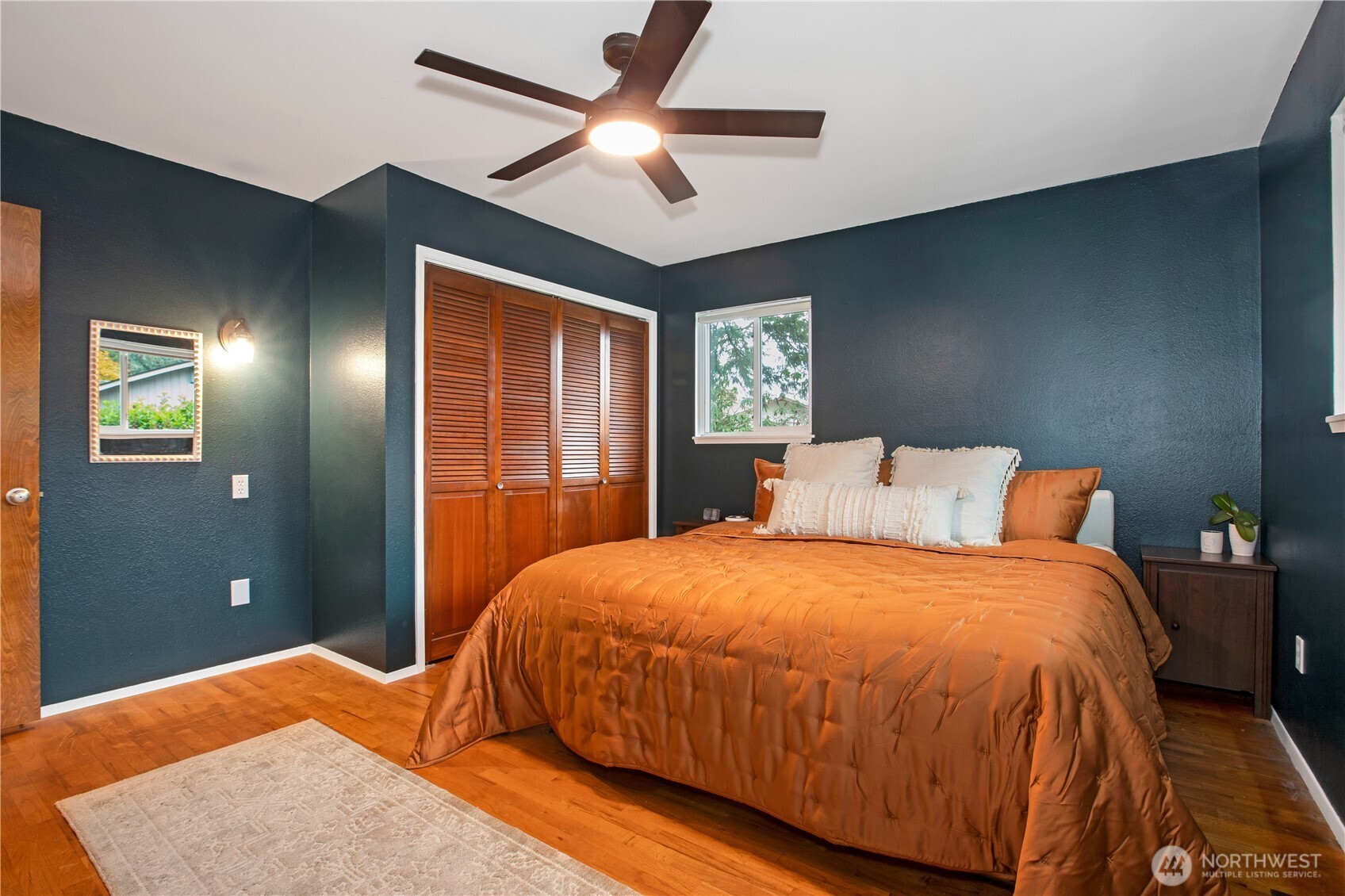 311 Ranger Drive Southeast Lacey, WA 98503 - Photo 16 of 35 a bedroom with a bed and a chandelier