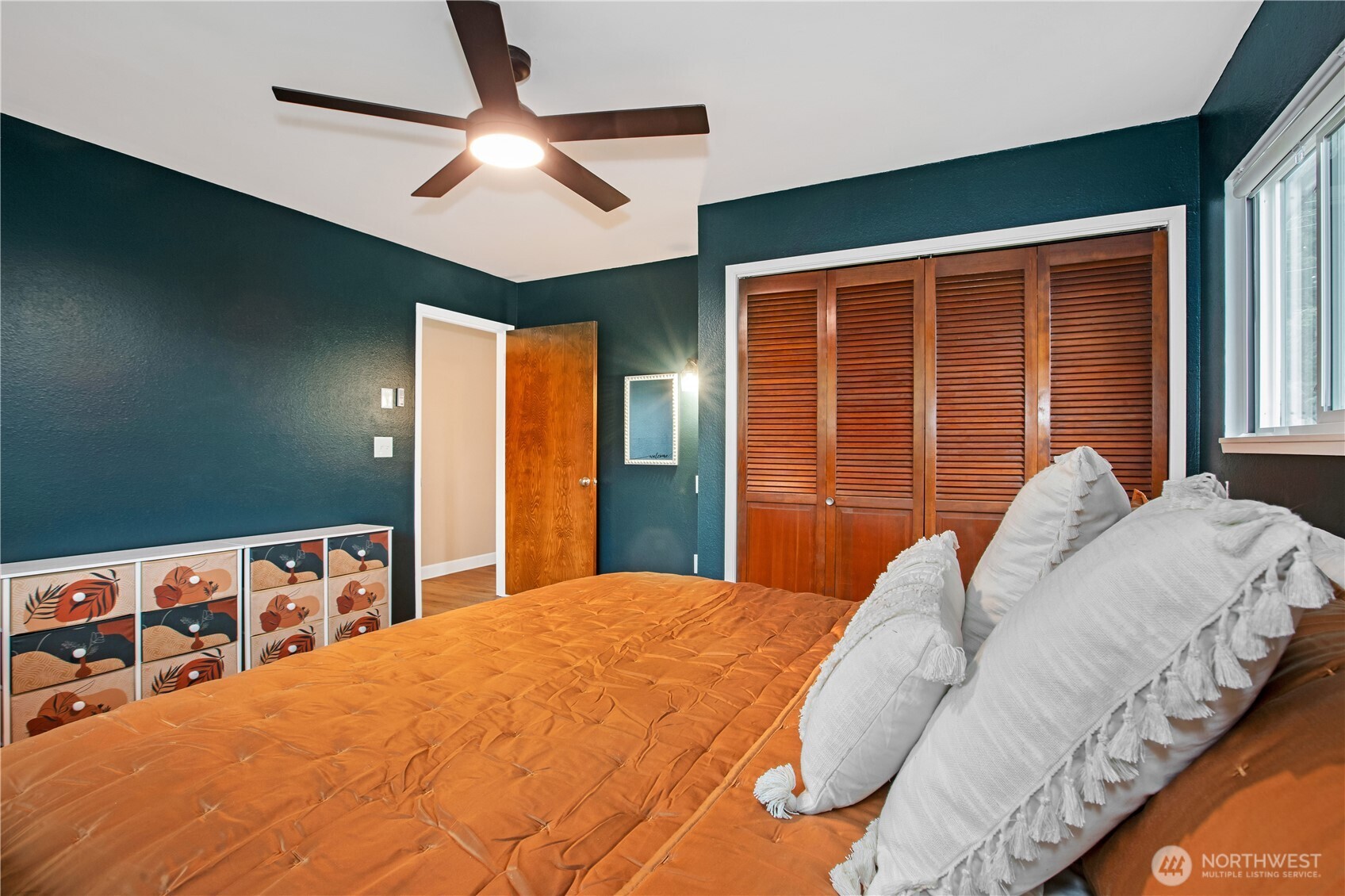 311 Ranger Drive Southeast Lacey, WA 98503 - Photo 17 of 35 a bedroom with a bed and a large window