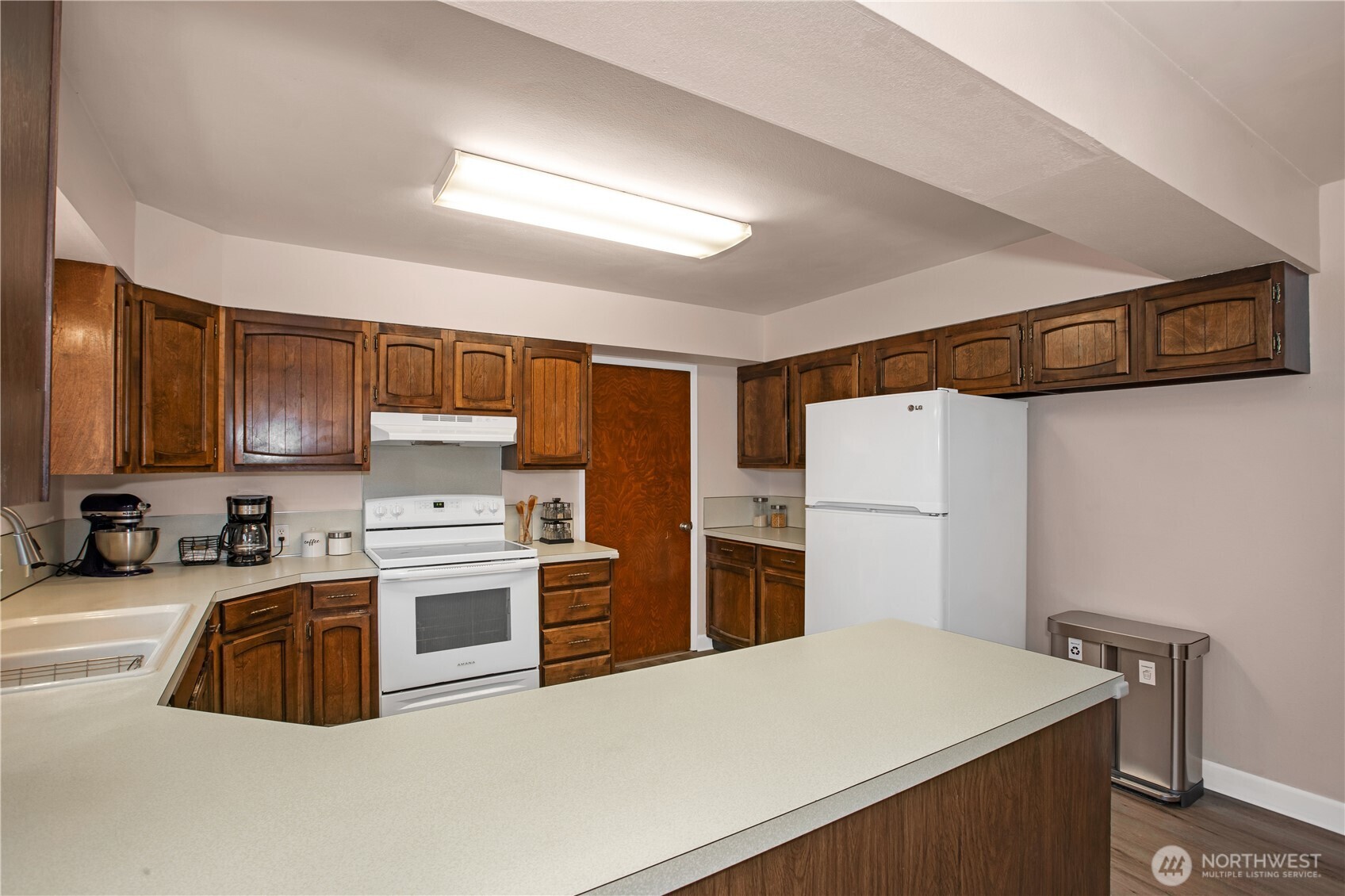 311 Ranger Drive Southeast Lacey, WA 98503 - Photo 23 of 35 a kitchen that has a sink cabinets and stainless steel appliances