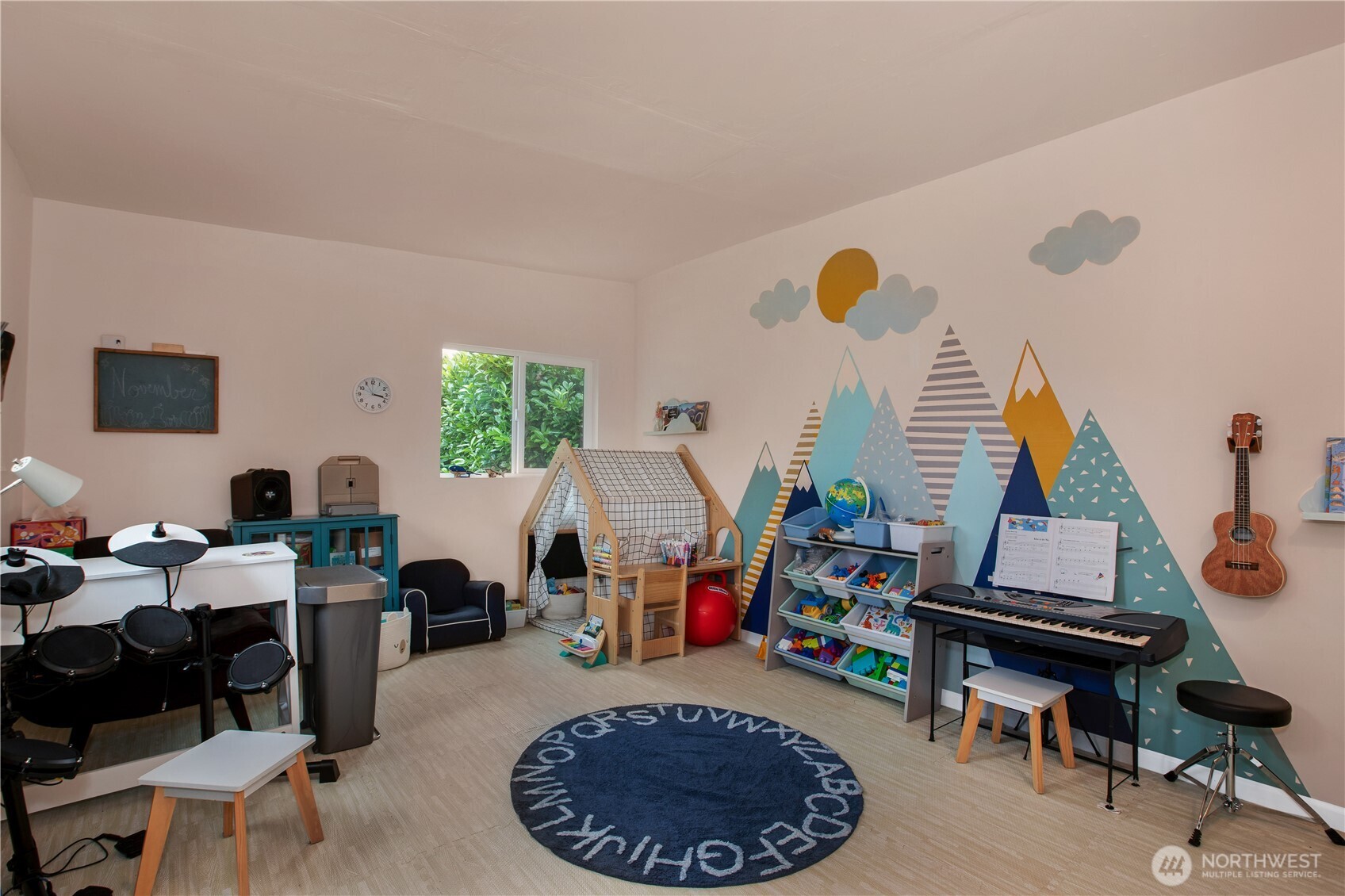 311 Ranger Drive Southeast Lacey, WA 98503 - Photo 31 of 35 a living room with furniture a rug and a window