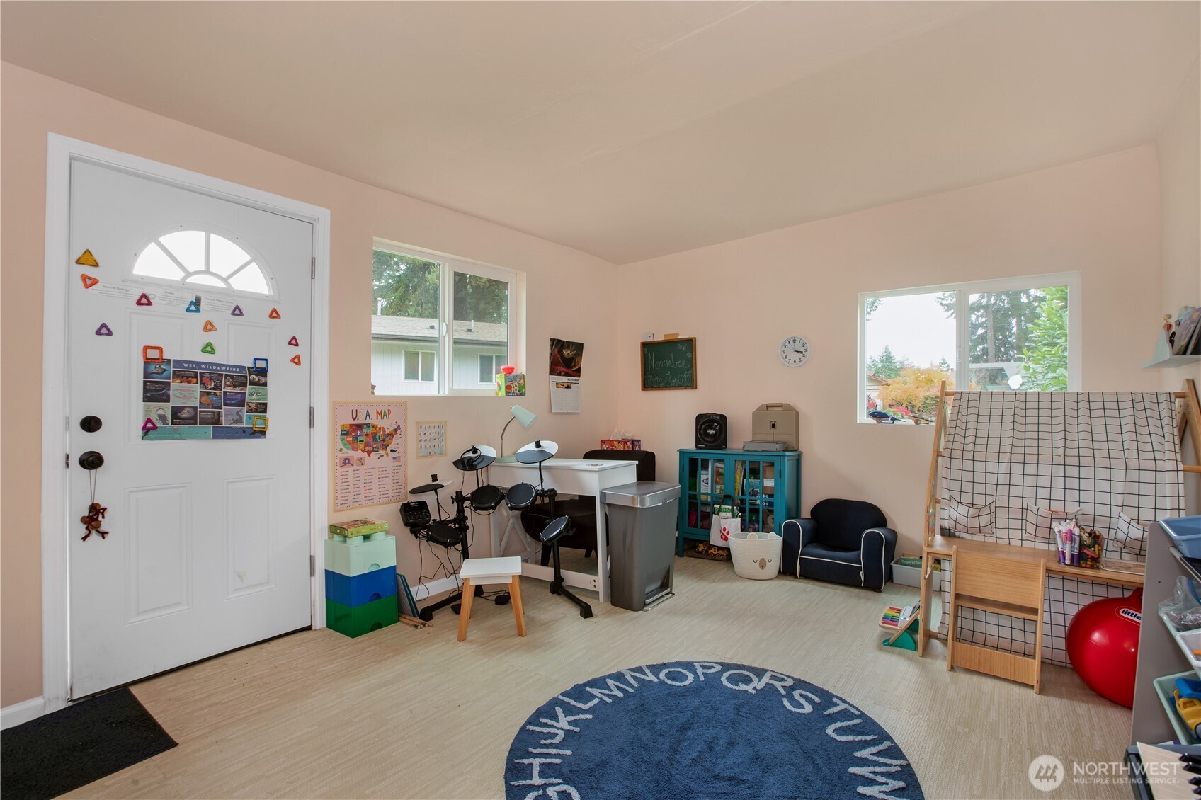 311 Ranger Drive Southeast Lacey, WA 98503 - Photo 32 of 35 a living room with furniture a window and a dining table