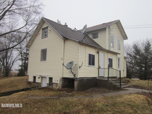 23182 Argo Fay Route Chadwick, IL 61014 - Photo 19 of 25 a view of a white house with a yard