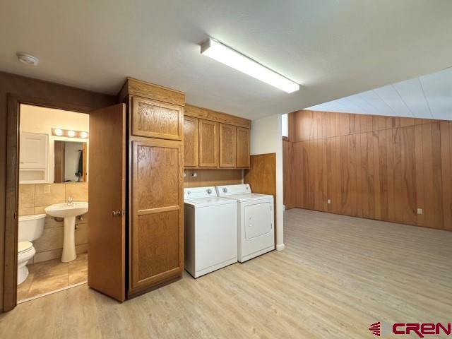 1221 First Street Alamosa, CO 81101 - Photo 12 of 40 a view of a kitchen with refrigerator and mirror
