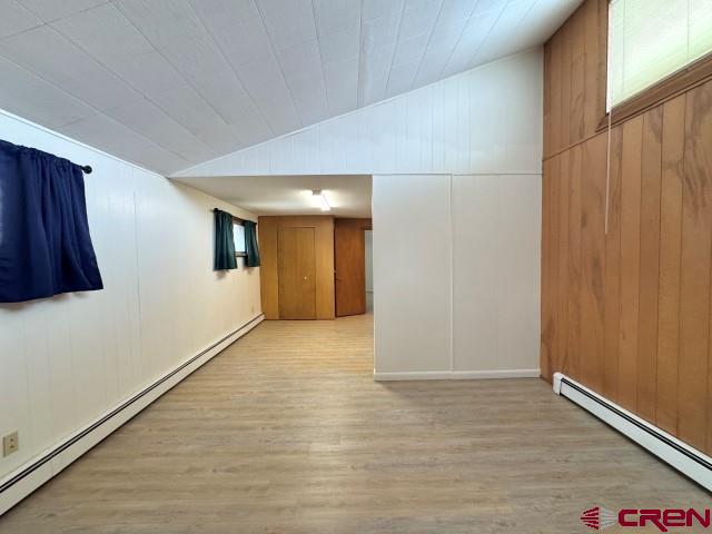 1221 First Street Alamosa, CO 81101 - Photo 16 of 40 a view of an empty room with wooden floor