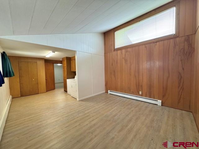 1221 First Street Alamosa, CO 81101 - Photo 17 of 40 a view of an empty room with wooden floor