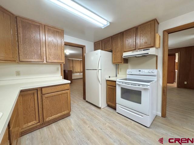 1221 First Street Alamosa, CO 81101 - Photo 20 of 40 a kitchen with granite countertop stainless steel appliances and wooden cabinets