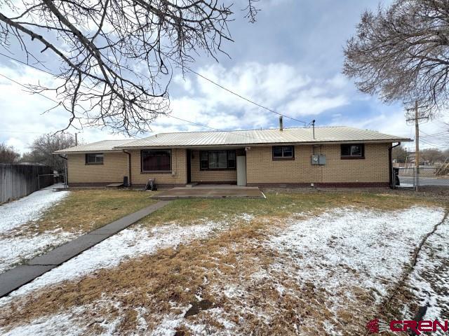 1221 First Street Alamosa, CO 81101 - Photo 2 of 40 a view of a house with a yard