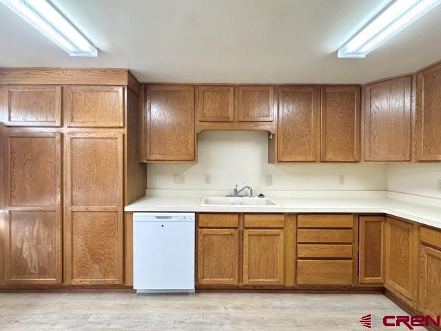 1221 First Street Alamosa, CO 81101 - Photo 21 of 40 a kitchen with a sink and cabinets