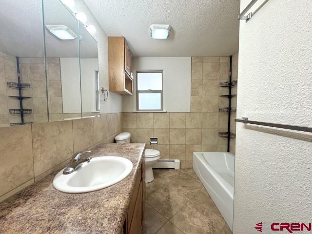 1221 First Street Alamosa, CO 81101 - Photo 27 of 40 a bathroom with a sink and a bathtub