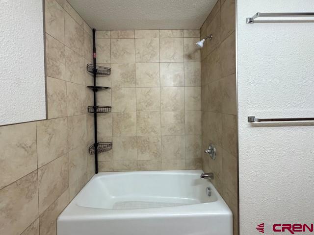 1221 First Street Alamosa, CO 81101 - Photo 28 of 40 a bathroom with a bathtub