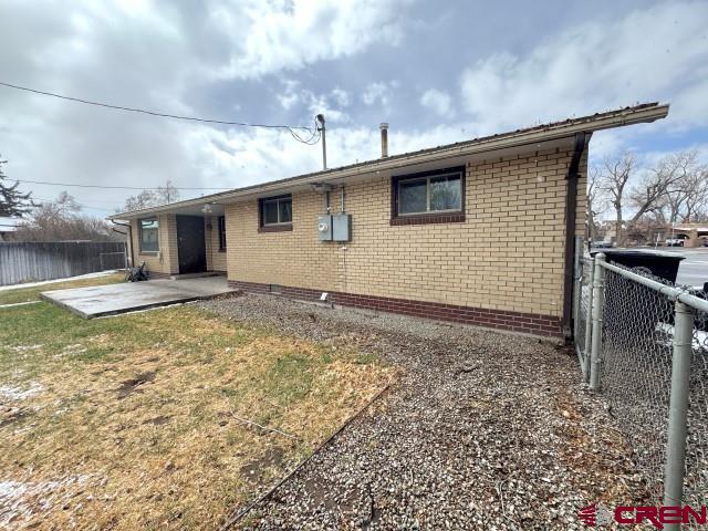 1221 First Street Alamosa, CO 81101 - Photo 37 of 40 a view of a house with a backyard