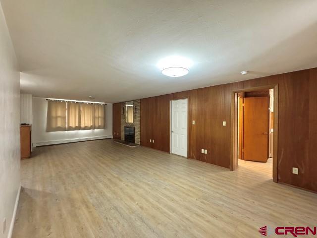 1221 First Street Alamosa, CO 81101 - Photo 7 of 40 an empty room with windows and cabinet