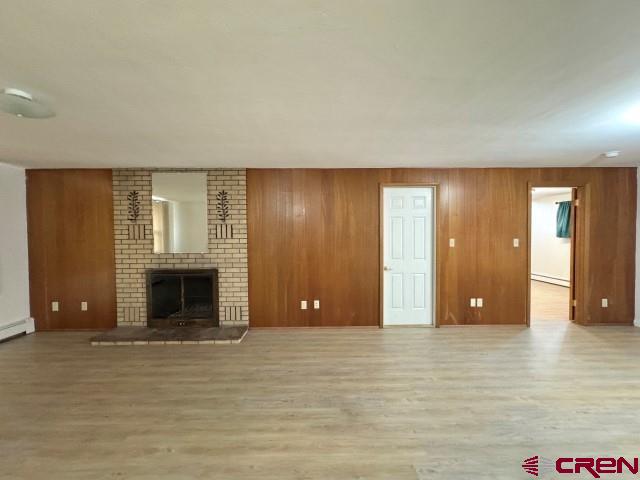 1221 First Street Alamosa, CO 81101 - Photo 8 of 40 a view of an empty room with a fireplace