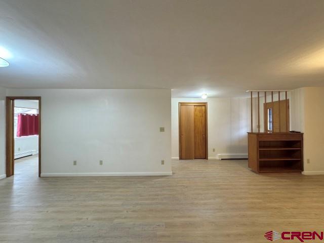 1221 First Street Alamosa, CO 81101 - Photo 9 of 40 a view of room with furniture and wooden floor