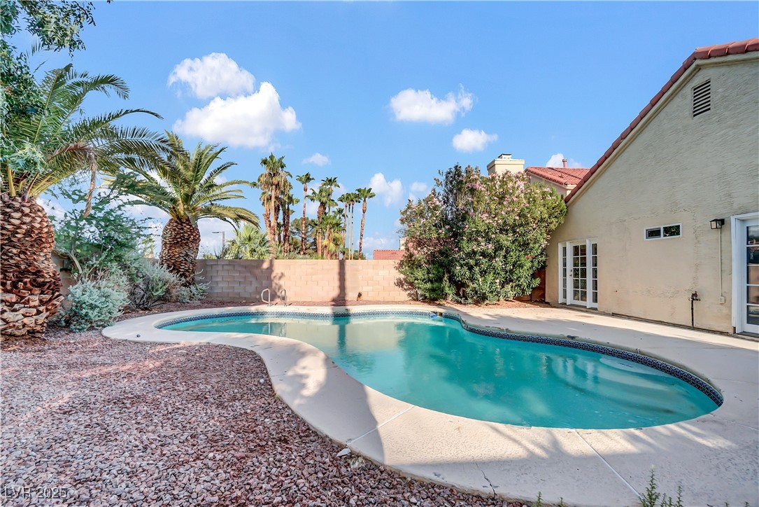 2716 Knightsbridge Road Henderson, NV 89074 - Photo 24 of 27 View of swimming pool featuring a fenced backyard, a patio, and french doors