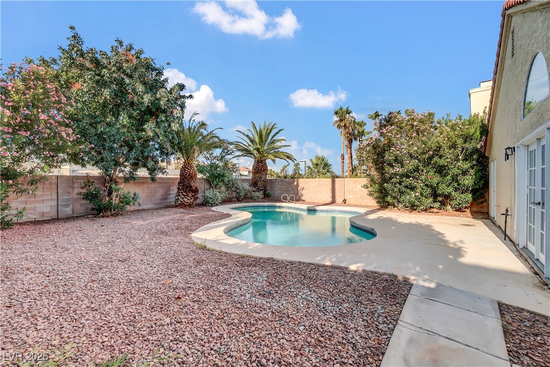 2716 Knightsbridge Road Henderson, NV 89074 - Photo 26 of 27 View of swimming pool with a fenced backyard and a patio