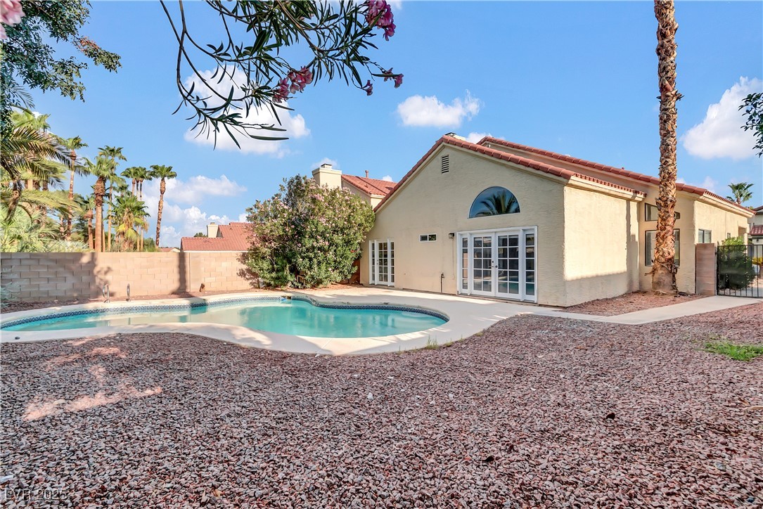 2716 Knightsbridge Road Henderson, NV 89074 - Photo 27 of 27 View of pool with a fenced backyard, french doors, and a patio