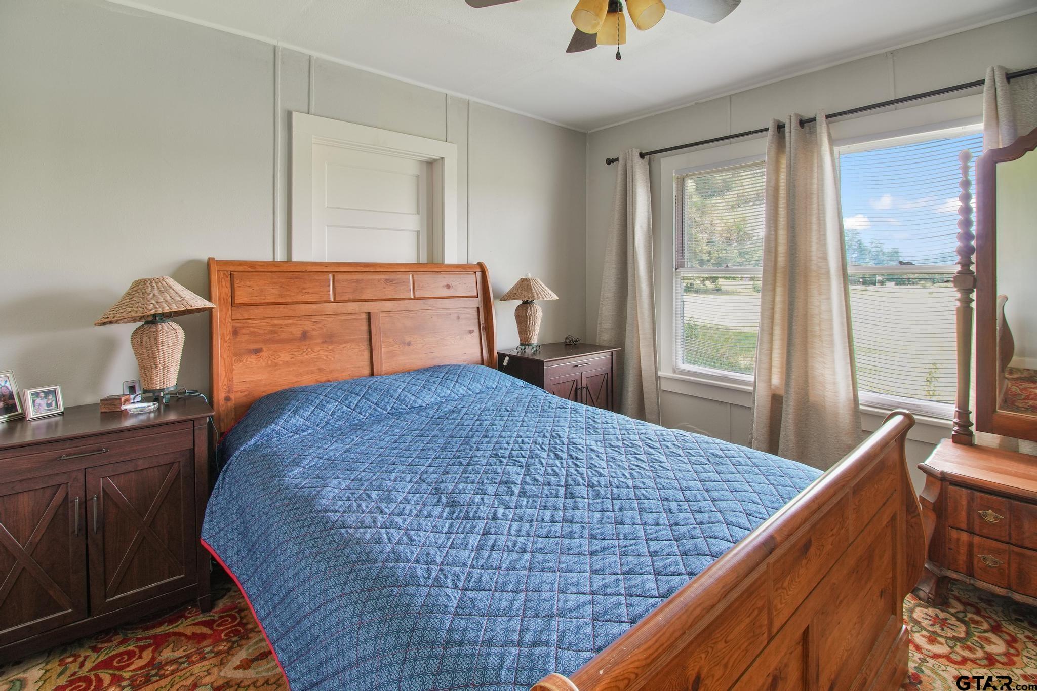 10864 State Highway 64 Overton, TX 75684 - Photo 11 of 32 a bedroom with a bed and window