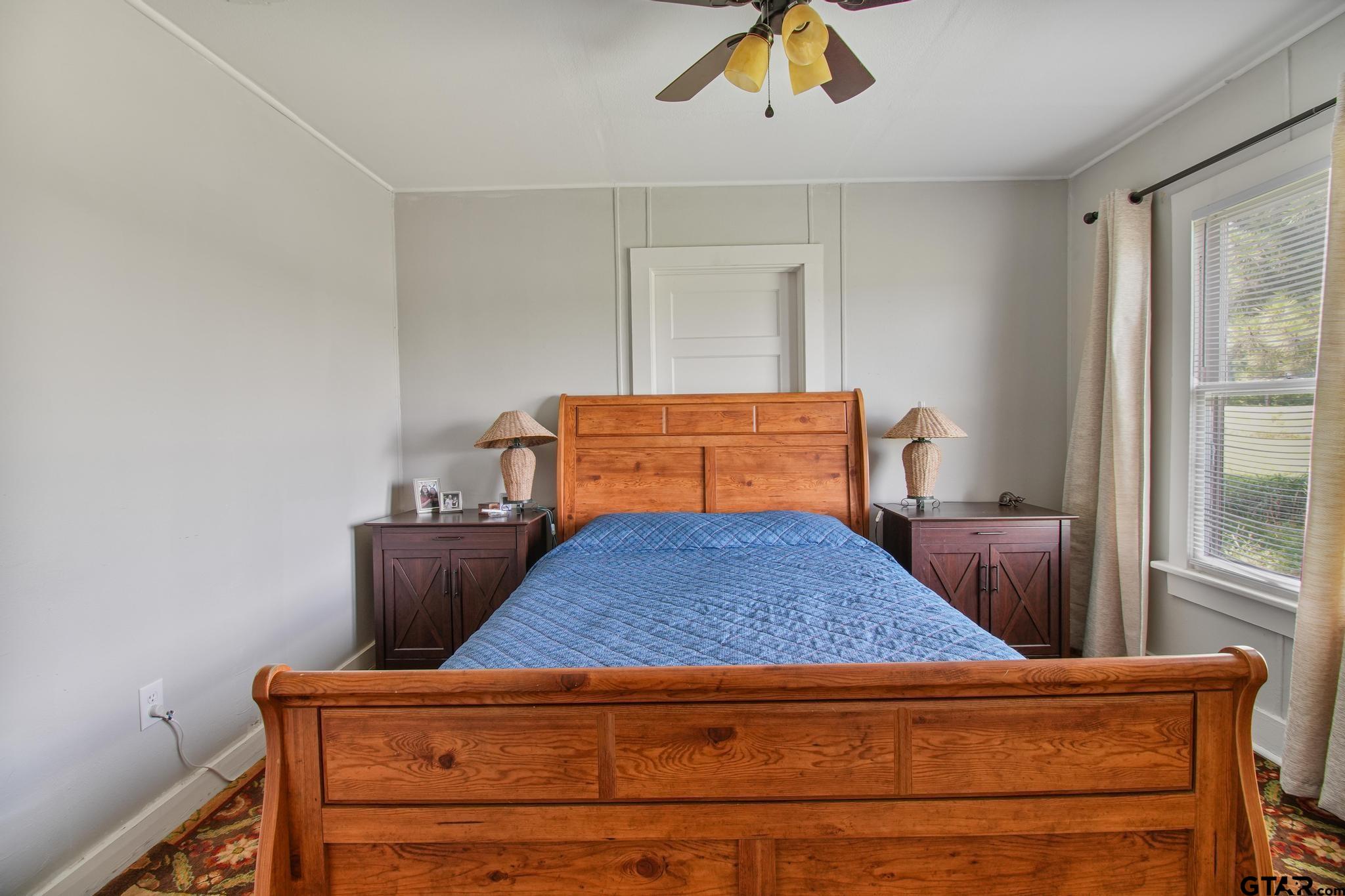 10864 State Highway 64 Overton, TX 75684 - Photo 12 of 32 a bedroom with a bed and window