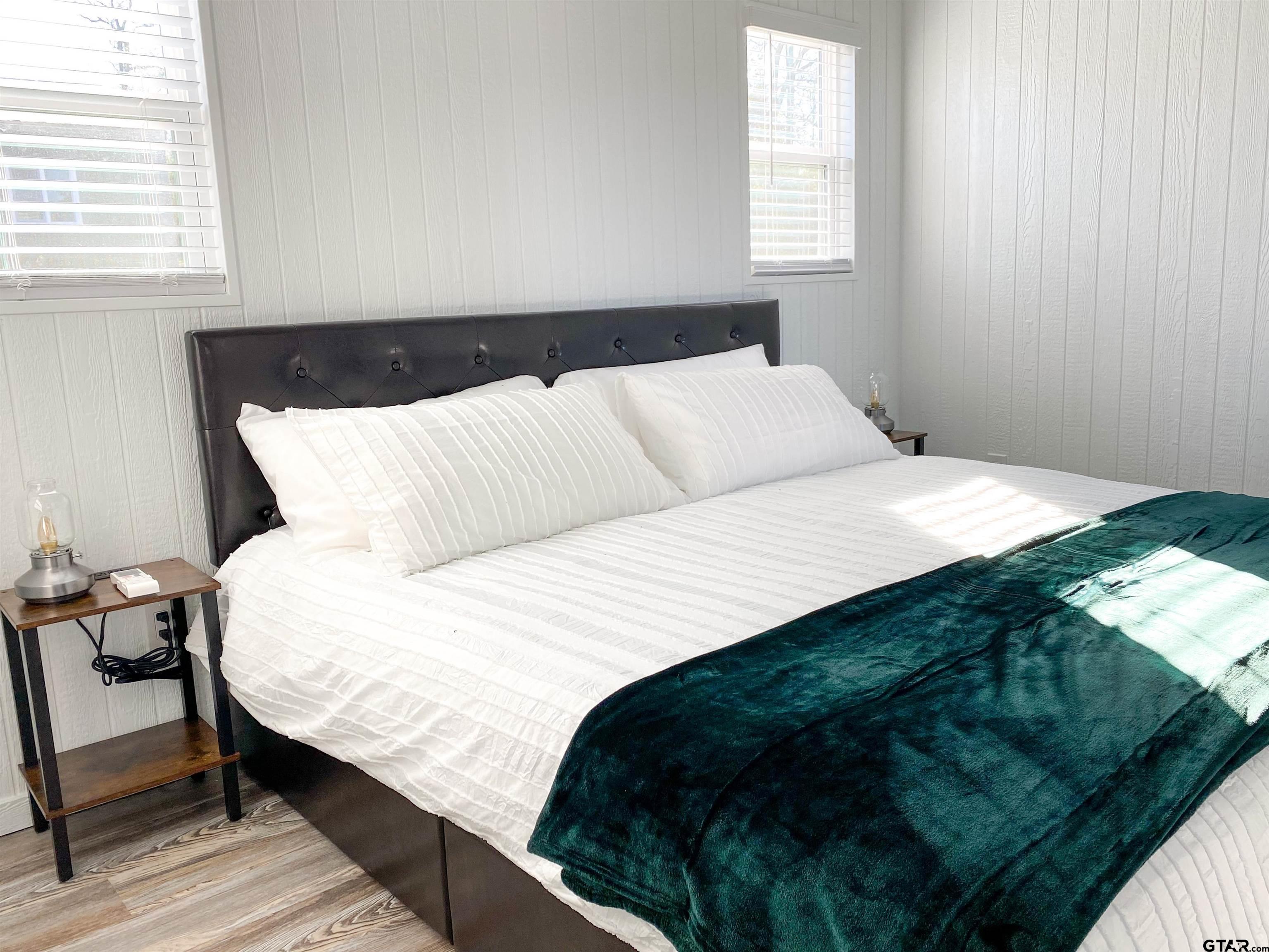 10864 State Highway 64 Overton, TX 75684 - Photo 22 of 32 a bedroom with a bed and window