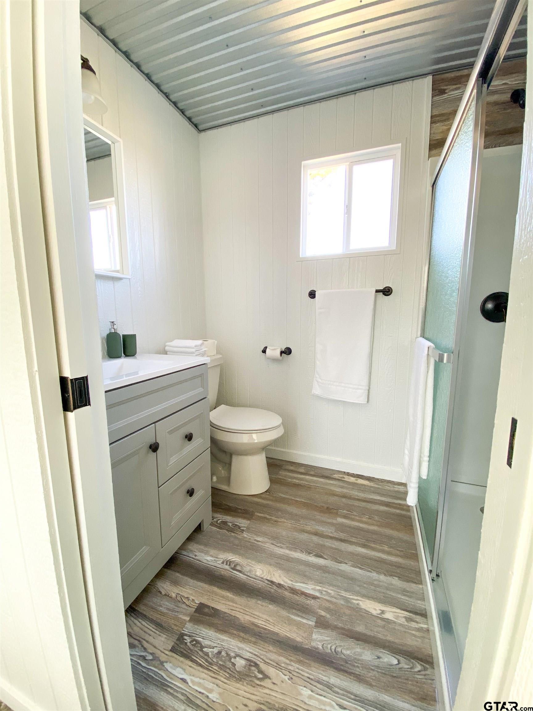 10864 State Highway 64 Overton, TX 75684 - Photo 24 of 32 a bathroom with a sink toilet and shower