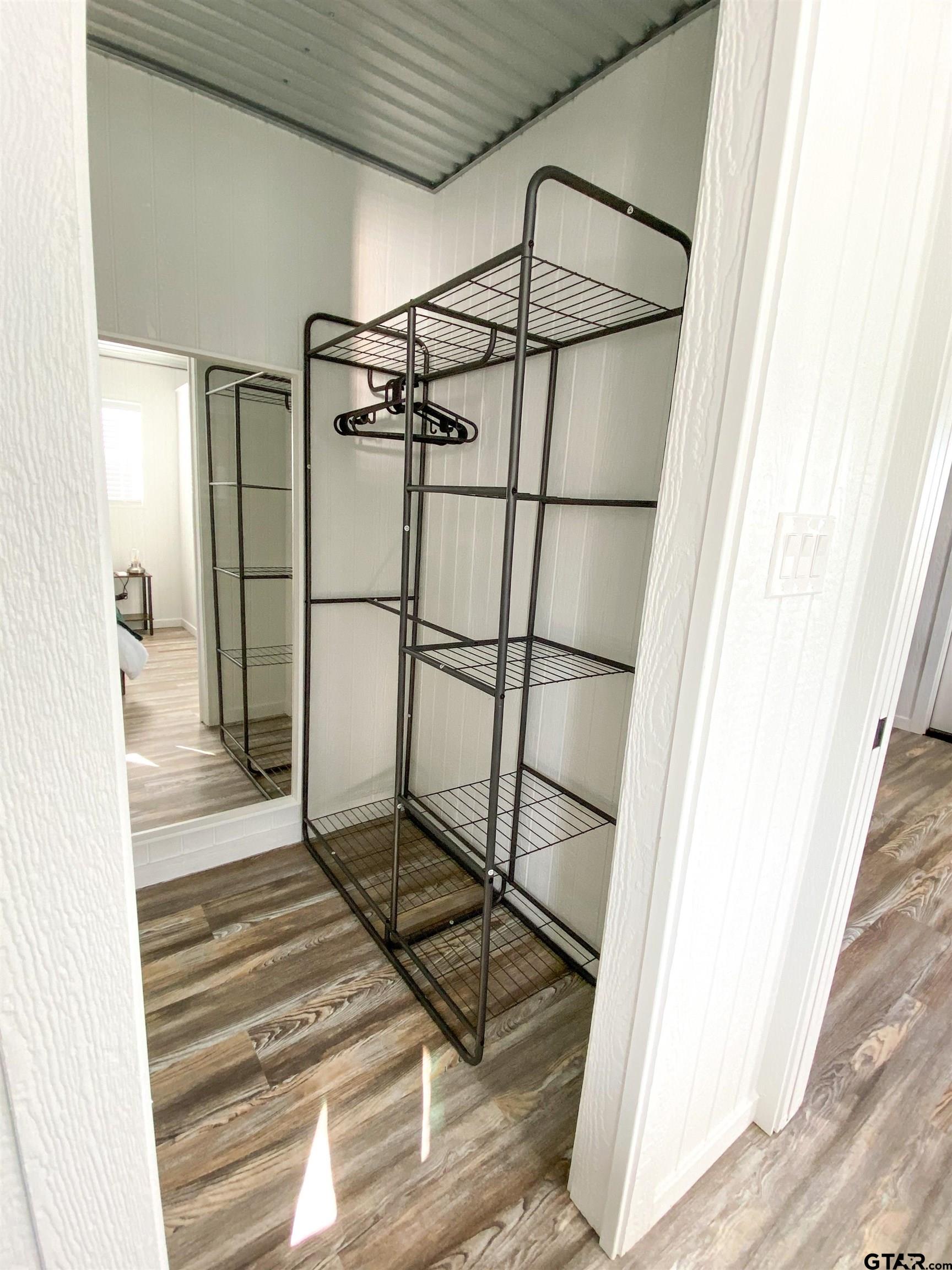 10864 State Highway 64 Overton, TX 75684 - Photo 27 of 32 a bathroom with a shower and a mirror