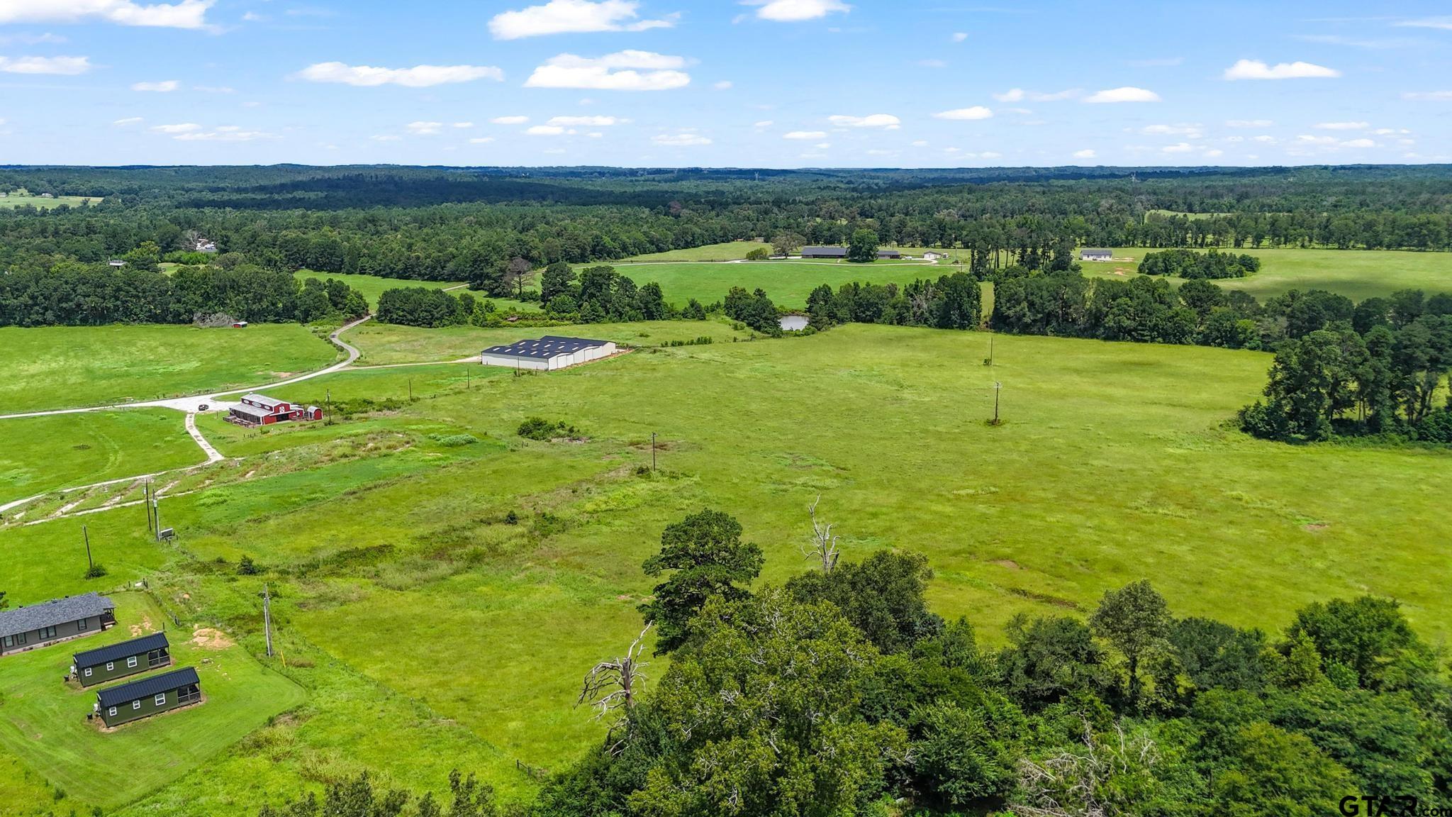 10864 State Highway 64 Overton, TX 75684 - Photo 29 of 32 a view of a lush green field