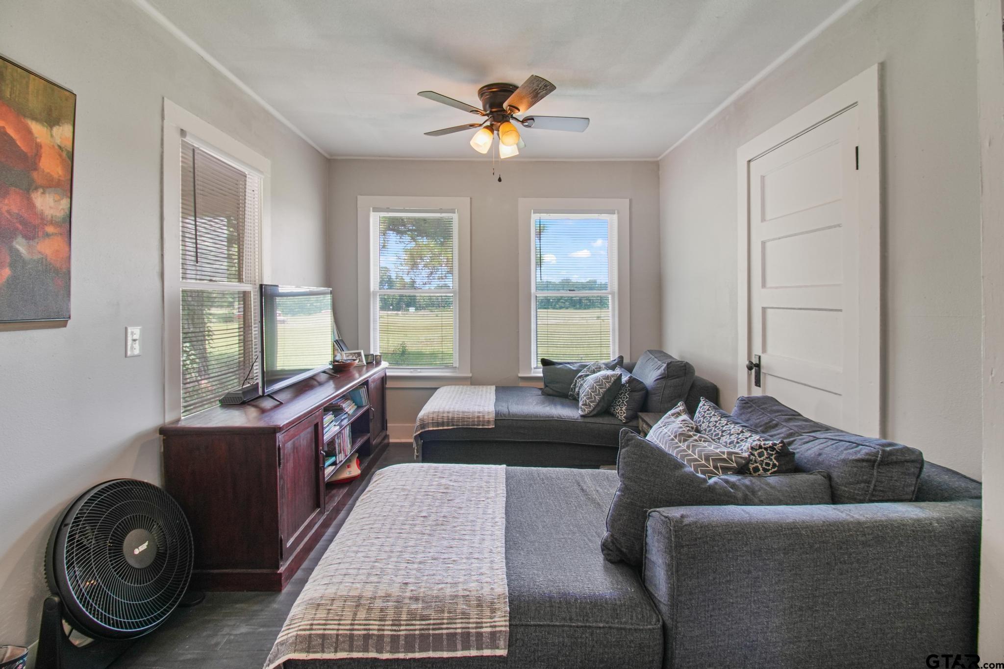 10864 State Highway 64 Overton, TX 75684 - Photo 3 of 32 a living room with furniture and a large window