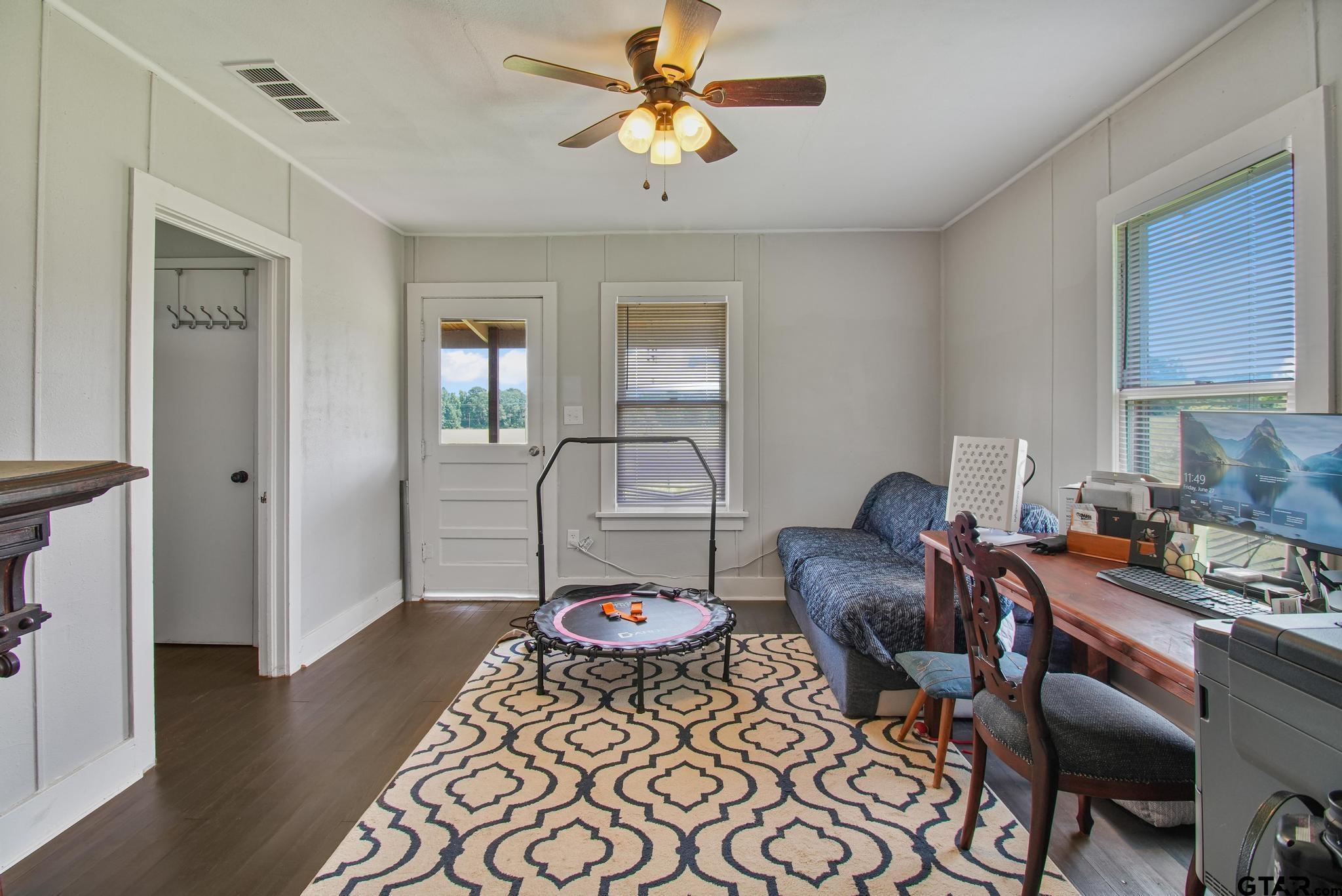 10864 State Highway 64 Overton, TX 75684 - Photo 9 of 32 a living room with furniture and wooden floor