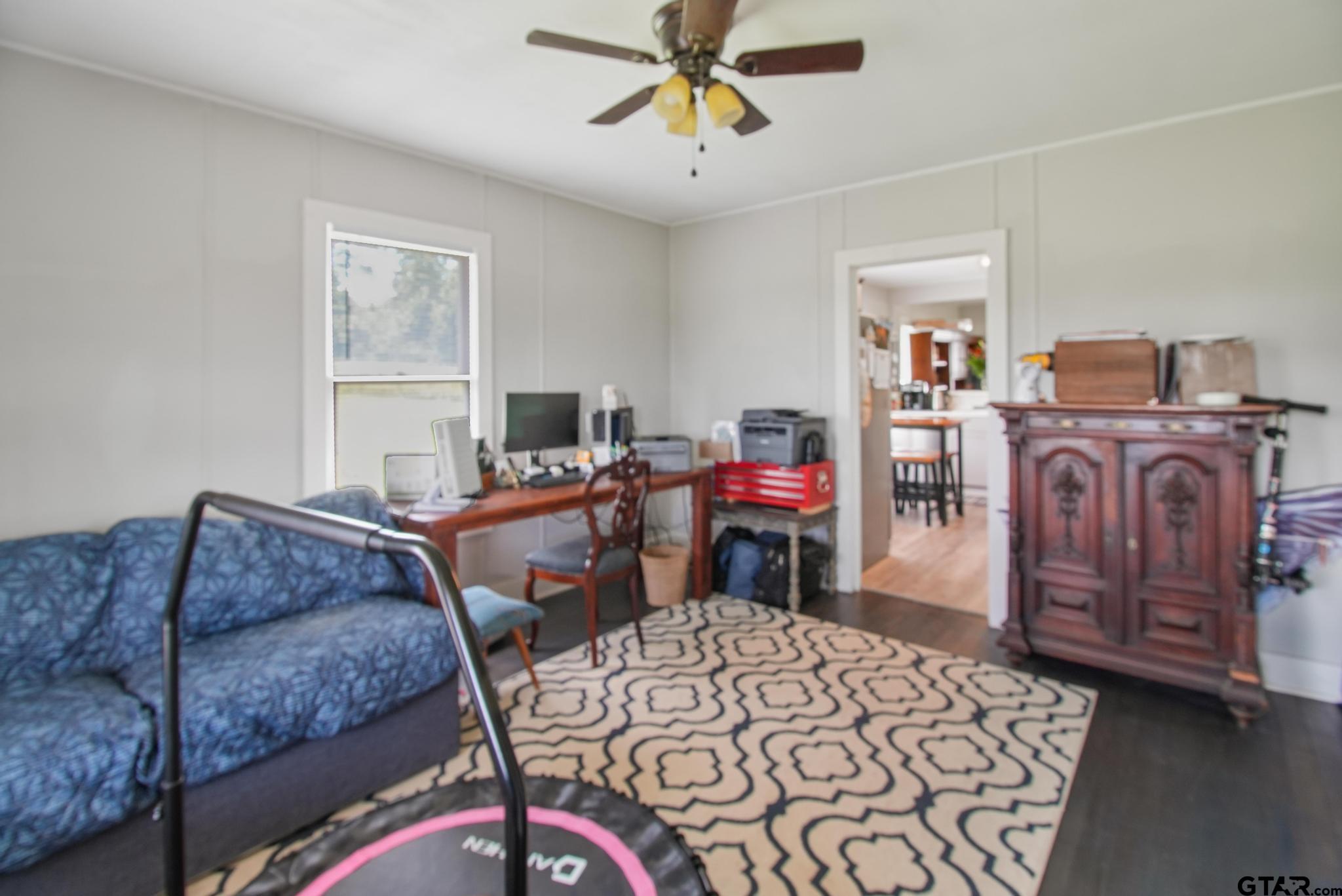 10864 State Highway 64 Overton, TX 75684 - Photo 10 of 32 a bedroom with a bed and dresser