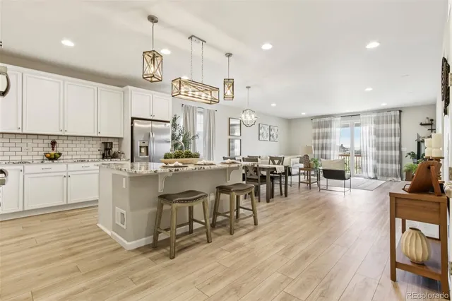 a large kitchen with lots of counter space a sink and appliances