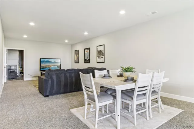 a view of a livingroom with furniture and a table