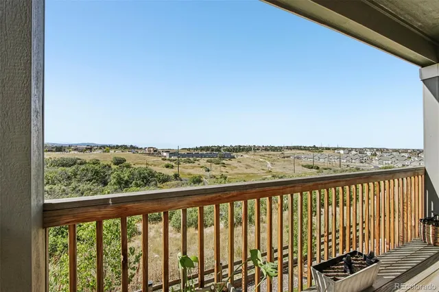 a view of balcony with wooden floor
