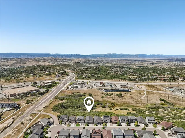 a sign that is sitting in front of flowers