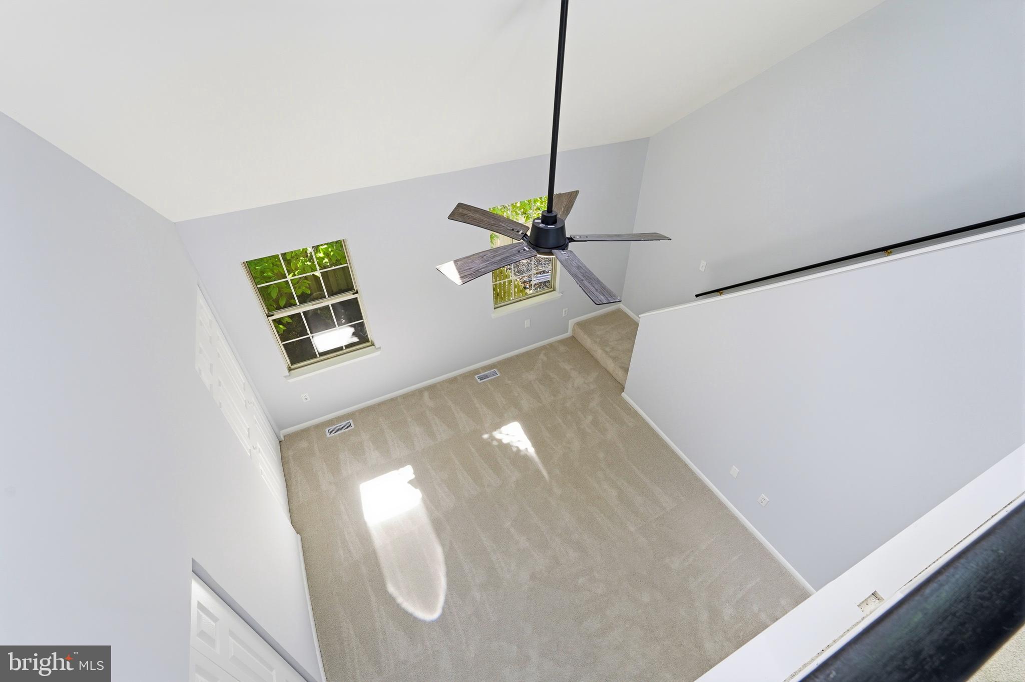 3682 Masthead Trail Triangle, VA 22172 - Photo 36 of 53 a view of a living room with a ceiling fan