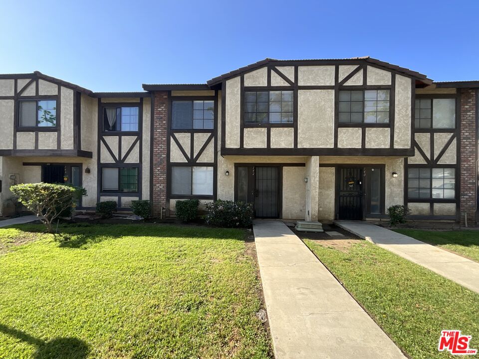 a front view of a house having yard