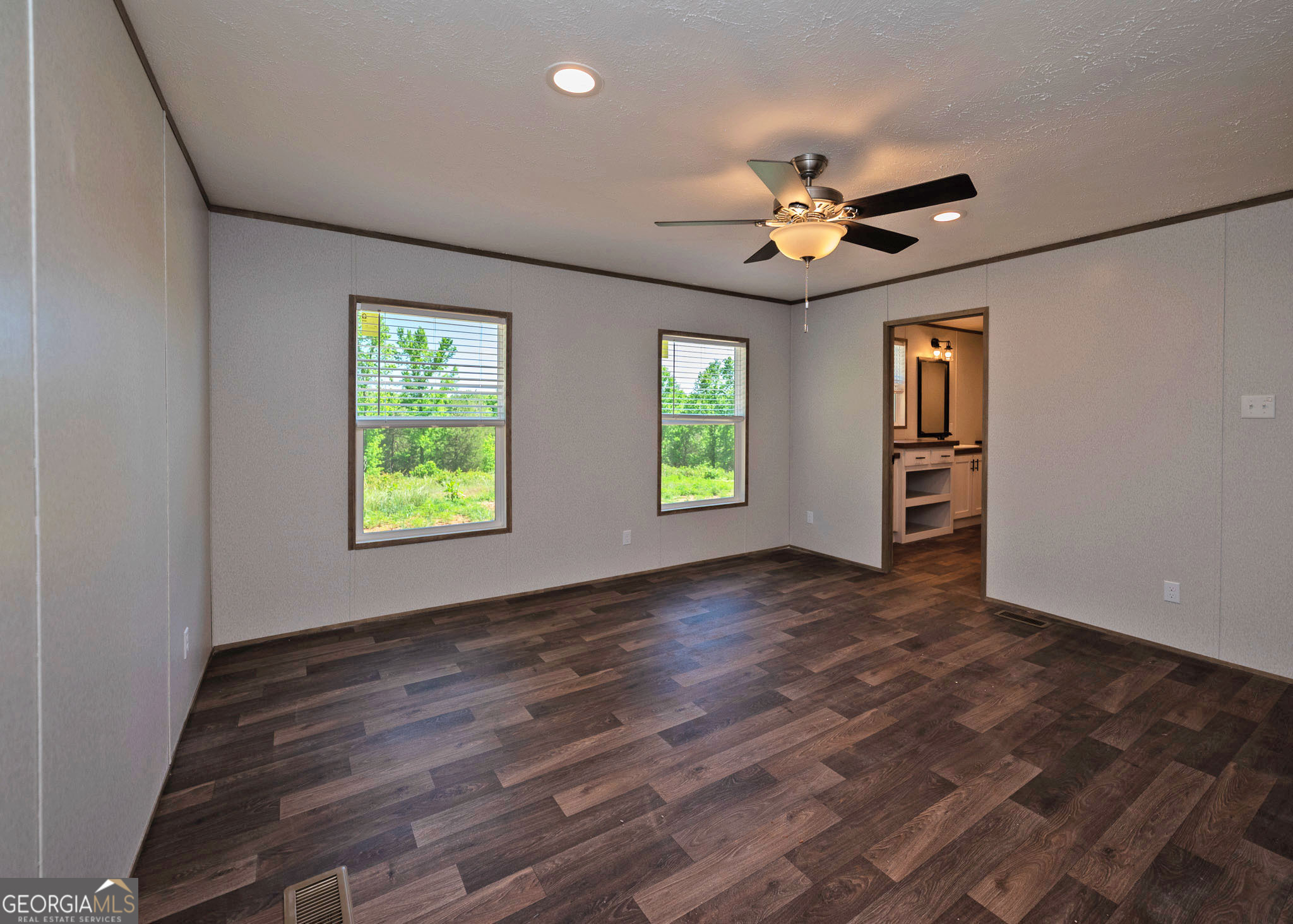 413 Griffin Road Martin, GA 30557 - Photo 14 of 31 an empty room with windows and ceiling fan
