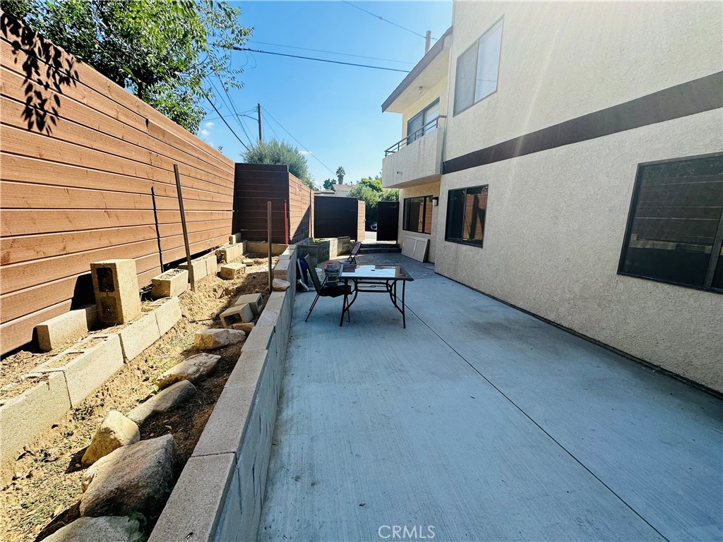 9961 Marcus Avenue, Unit 1 Tujunga, CA 91042 - Photo 16 of 16 a view of the patio with couches and potted plants