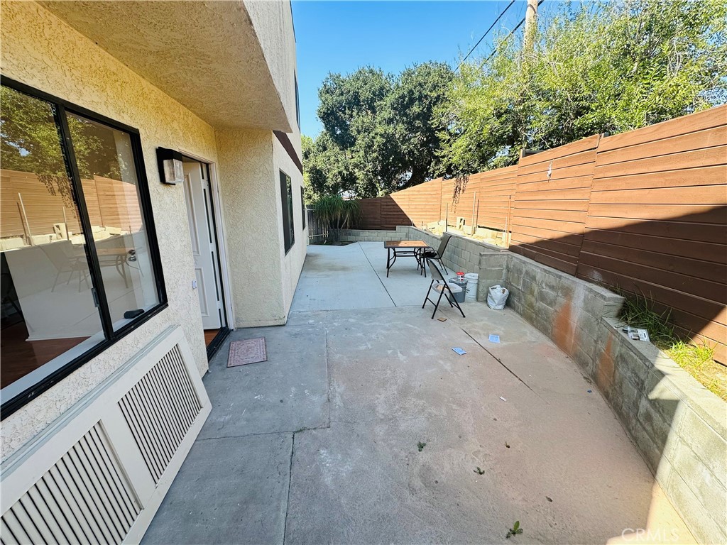 9961 Marcus Avenue, Unit 1 Tujunga, CA 91042 - Photo 6 of 16 a view of a patio with two chairs and a table
