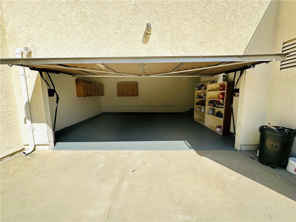 9961 Marcus Avenue, Unit 1 Tujunga, CA 91042 - Photo 10 of 16 a view of a garage with furniture